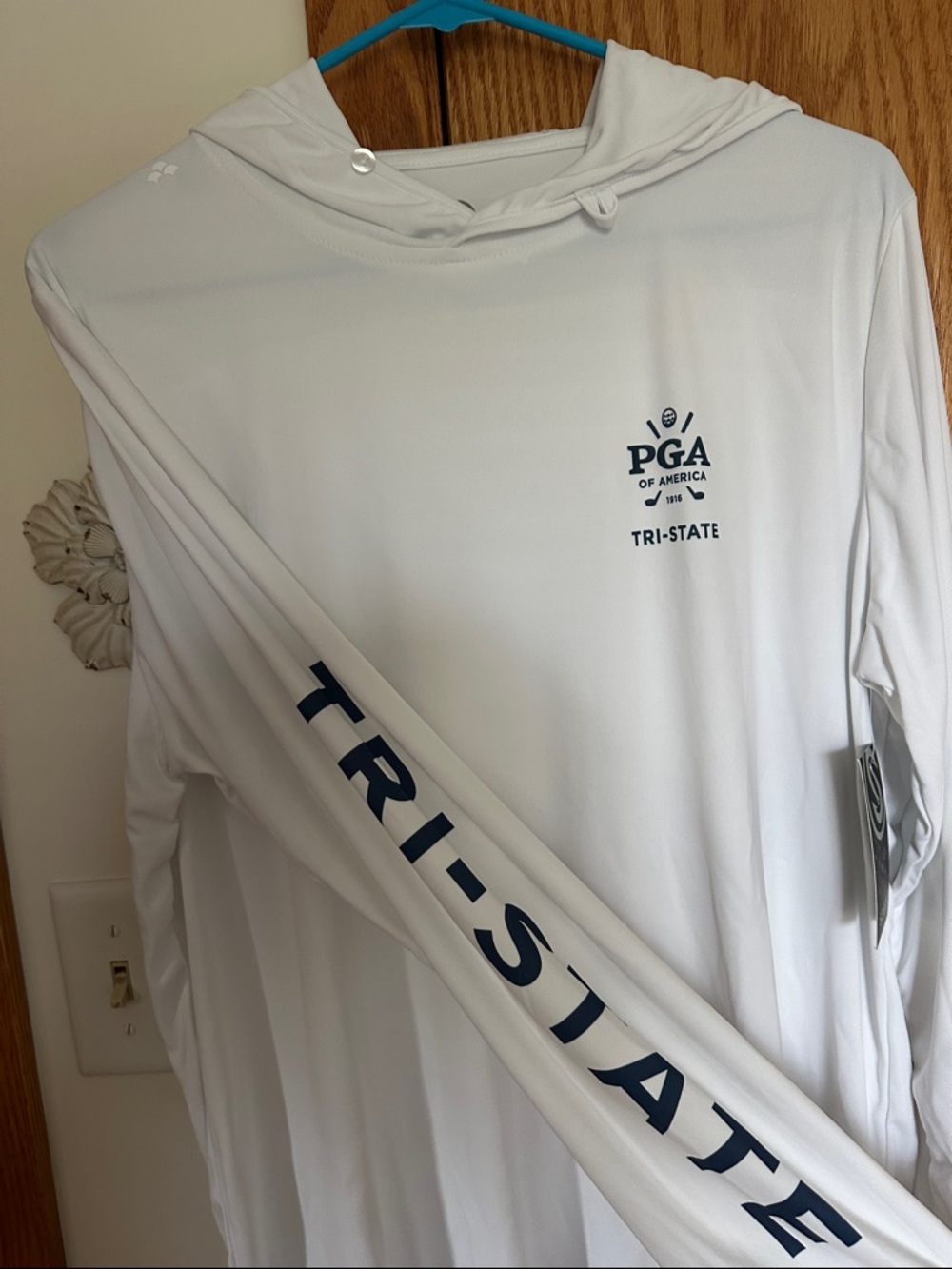 Huk White Long Sleeve Hooded Performance Golf Shirt with Navy Sleeve Text